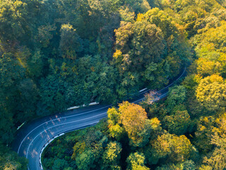 Aerial drone top down video. Mountain road traffic.