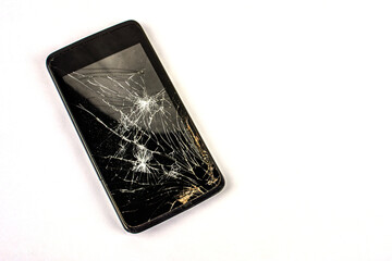 Smartphone with broken screen .Broken mobile phone lying on pavement