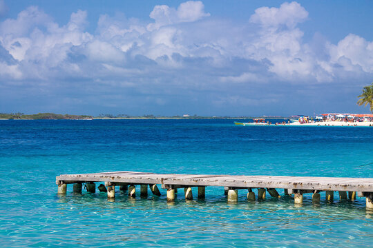 People at the bottom of a boarding dock in Cayo Sombrero of the Morrocoy National Park in the Cuare reserve