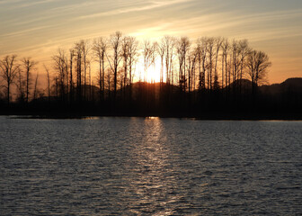 Late autumn sunset sparkling in the wrinkled lake