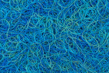 Tangled wool yarn threads as chaos background