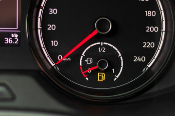 Fuel discharge warning light on the dashboard of the car. The low fuel level is displayed on the dashboard of the speedometer.
