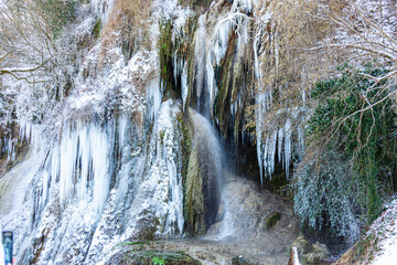 Fototapeta na wymiar Frozen waterfall in the winter