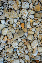Abstract background beach with large and small pebbles. View from above