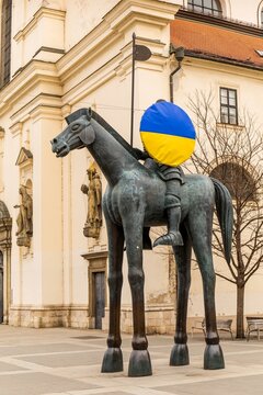 Brno, Czech Republic, March 7, 2022: The Statue of Margrave Jost in Brno, South Moravia, Czech republic. Flag of Ukraine on a statue. Support for Ukraine. War in Ukraine.