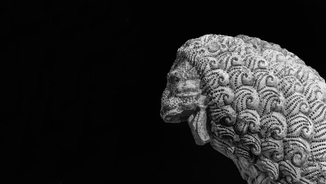 Medieval ferocius lion statue, in the the Lucca old walls public park (Black and White with copy space)