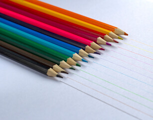 colored pencils on a white background