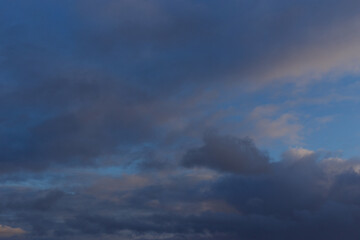 A dark blue autumn sky with thunderclouds and white clouds. Ready for use with «Sky Replacement» feature in the Adobe Photoshop.	