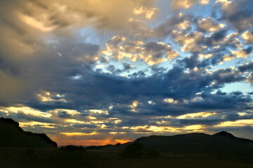 desert sunset with orange clouds