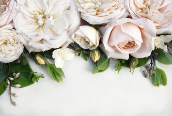 Delicate blooming festive roses and light pink flowers background, blossoming rose flower soft...