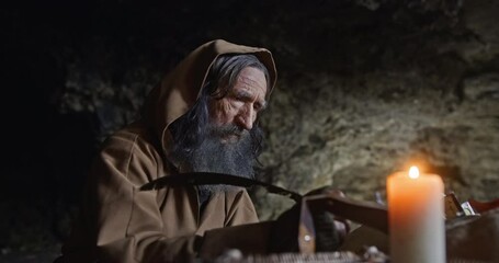 Monk chronicler writes an ancient manuscript