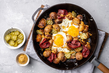 Potato hash brown with fried eggs and meat pastrami for breakfast branch - obrazy, fototapety, plakaty