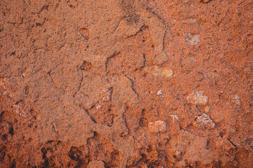Vintage red clay wall background. Photo of the surface of the fortress wall.