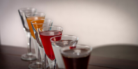 Coctail alcohol drinks on wooden brown table