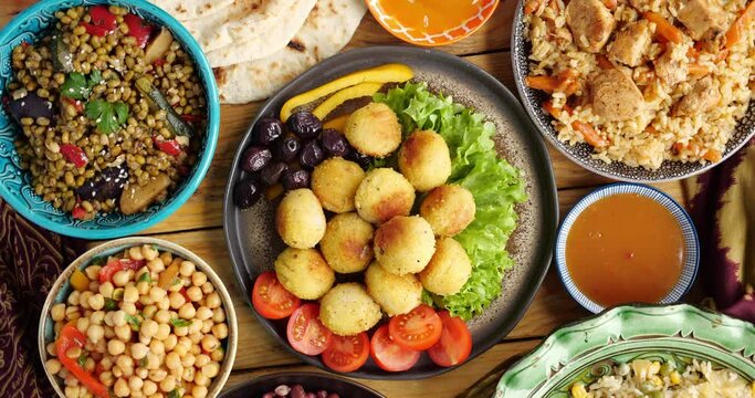 Ramadan recipe. Falafel is a deep-fried ball fritter made from ground chickpeas. Falafel is a traditional Middle Eastern food. The falafel balls are topped with salad, vegetables, hot sauce