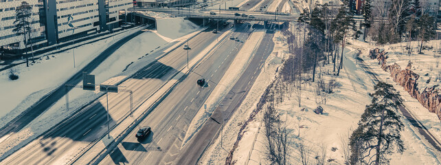 Aerial view of the highway and intersection in the city on a winter day
