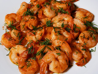 Fried king prawns on a white plate, close-up