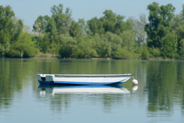 Naklejka na ściany i meble picture of small boat floating