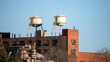 old abandoned factory water towers brick building