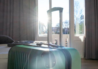 suitcase luggage baggage room hotel window balcony bed sun sunshine shadow
