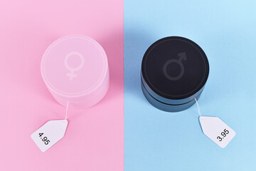 Concept for pink tax showing pink and black facial cremes aimed at specific genders with different...