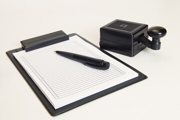 Morse code key, notepad and pen