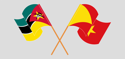 Crossed and waving flags of Mozambique and Tigray