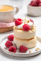 Cottage cheese pancakes or syrniki with raspberries