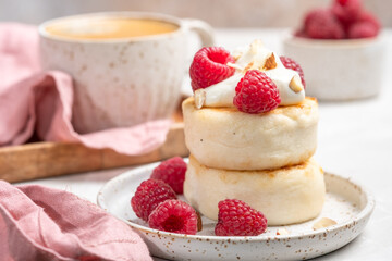 Cottage cheese pancakes or syrniki with raspberries