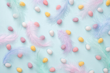 Happy Easter concept. Beautiful greeting card. Preparation for holiday. Easter candy chocolate eggs on trendy pastel blue background. Simple minimalism flat lay top view copy space