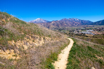 A Hiking an Biking Trail in the California Crafton Hills Near Yucaipa after a Wet Winter with Grass Growing