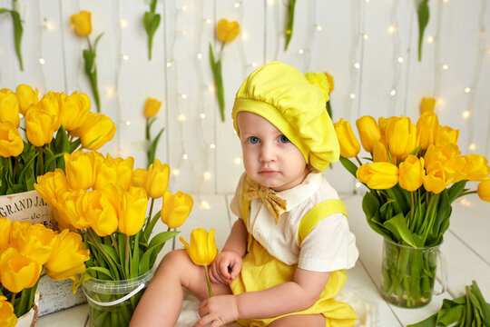 Greeting card. Cute child with colorful tulips flower. Mother's Day, March 8, International Women's Day concept