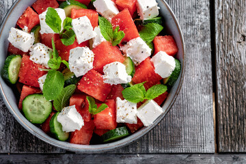 Summer salad with watermelon, mint, cucumber and feta cheese close up