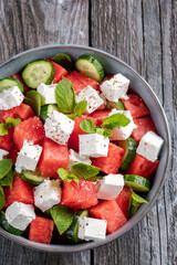 Summer salad with watermelon, mint, cucumber and feta cheese close up