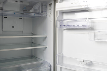 Empty refrigerator. Door open of a refrigerator that is empty.  