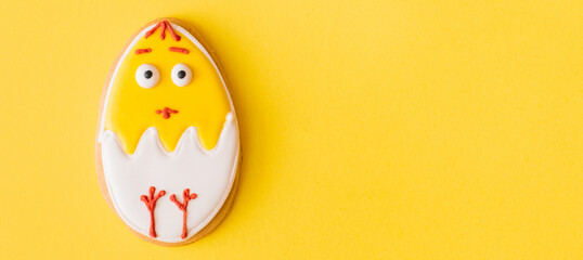 Banner made Yellow easter cookies on yellow background. Easter concept. Top view, flat lay, copy space