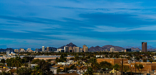 WIDE PANORAMIC SKYLINES OF TUCSON ARIZONA WITH BLUE SKY