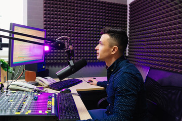 a radio host conducts a live broadcast in a professional radio studio. 