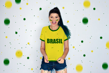 Fototapeta premium Woman cheering for Brazil's team