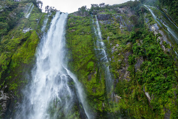 Fototapeta na wymiar Beautiful Waterfall, Milford Sound, New Zealand