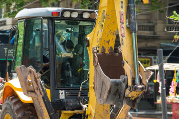 working bulldozer working on city streets
