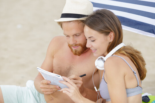 A Relaxed Couple Doing Crossword