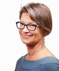 Maturity and confidence. Studio shot of a mature woman isolated on white.