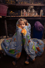 Ukrainian girl takes shelter in her basement.