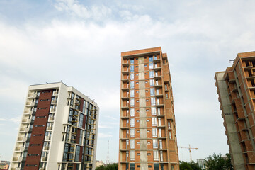 High residential apartment buildings under construction. Real estate development.