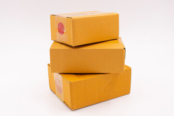 Three cardboard boxes are stacked on a white background, Online Selling Business Ideas.