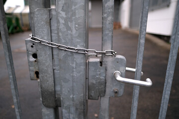 iron chain on the door, securely locked, entry is strictly prohibited, concept prison, security zone, symbol of bondage, hopelessness of captivity