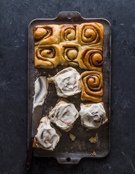 Overhead view&nbsp;of freshly baked cinnamon buns on baking sheet
