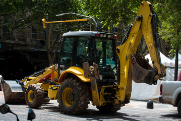 working bulldozer working on city streets