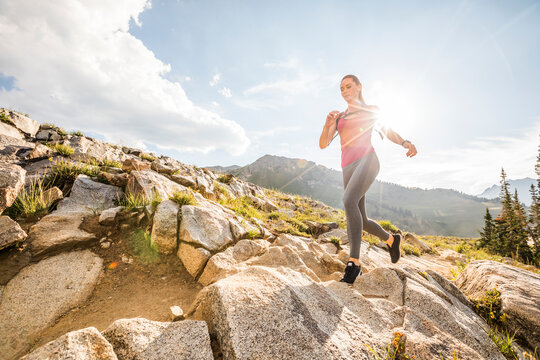 United States, Utah, Alpine, Woman jogging in mountains in summer